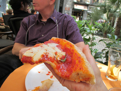3 photos show the pizza, covered with tomato sauce and about half of it covered with mozarella cheese and 3-4 leaves of basil.